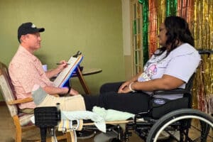 Operations Assistant and Admissions Director La-Crisha Rockins receiving rehab from physical therapist